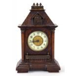 A 19TH CENTURY BRASS MOUNTED OAK ARCHITECTURAL CASED MANTLE CLOCK, THE TIMEPIECE WITH PRIMROSE