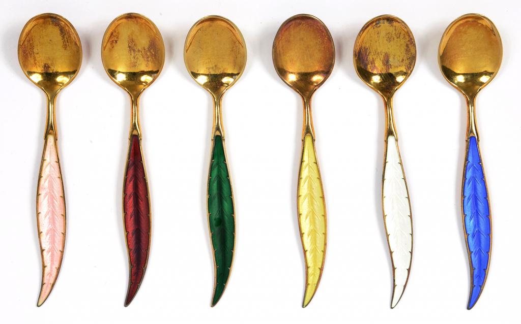 A SET OF SIX NORWEGIAN SILVER GILT AND HARLEQUIN GUILLOCHE ENAMEL LEAF SHAPED COFFEE SPOONS, BY