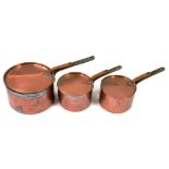 THREE GRADUATED VICTORIAN COPPER SAUCEPANS AND LIDS, CIRCA 1900