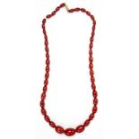 A NECKLACE OF CHERRY AMBER BEADS, 34.5G