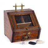 AN UNUSUAL LATE VICTORIAN BRASS MOUNTED OAK SEWING BOX IN THE FORM OF A PURDONIUM, 23CM H