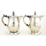 TWO MATCHING VICTORIAN SILVER MILK JUGS, ENGRAVED ATHENAEUM [CLUB] 1824 AND UNDER THE FOOT,