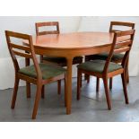A 1970'S NATHAN FURNITURE TEAK EXTENDING DINING TABLE WITH A SET OF FOUR SIMILAR CHAIRS
