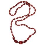 A NECKLACE OF CHERRY AMBER BEADS, 37.7G