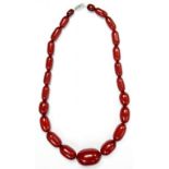 A NECKLACE OF CHERRY AMBER BEADS, 53.8G