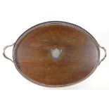 AN EPNS PIERCED OVAL GALLERY TRAY WITH OAK INSET BASE, 69CM W, CIRCA 1910 AND A CASED SET OF