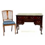 A MAHOGANY WRITING TABLE AND AN INLAID CHAIR AND A BOW FRONTED LLOYD LOOM TYPE OTTOMAN