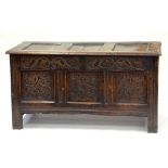 A 17TH CENTURY CARVED OAK BLANKET CHEST WITH PANELLED LID, 68CM H X 128CM X 56CM
