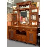 A VICTORIAN CARVED OAK AND MIRROR BACKED SIDEBOARD, 240CM H X 182CM X 58CM