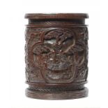 A CHINESE CARVED BAMBOO BRUSH POT covered in a dark stain, 16.5cm h ++In fine condition