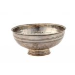 A RUSSIAN SILVER BOWL chased with stylised flowers, 18cm diam, Cyrillic maker's mark, Tiflis 1850,