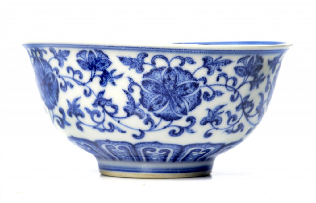 A CHINESE BLUE AND WHITE BOWL painted in Ming style with lotus meander, 11.5cm diam, Qianlong