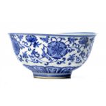 A CHINESE BLUE AND WHITE BOWL painted in Ming style with lotus meander, 11.5cm diam, Qianlong