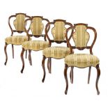 A SET OF FOUR VICTORIAN CARVED WALNUT CHAIRS, C1870 with padded splat, 86cm h ++Structurally