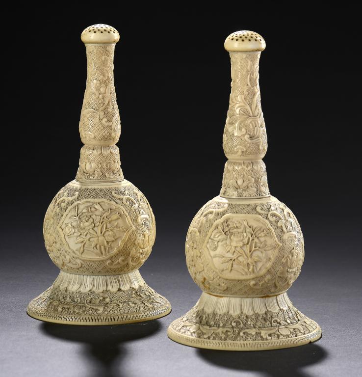 A PAIR OF CHINESE IVORY ROSEWATER SPRINKLERS, QING DYNASTY, 19TH C of bulbous form and finely carved
