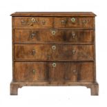 A QUEEN ANNE WALNUT AND FEATHERBANDED CHEST OF DRAWERS, EARLY 18TH C with quarter veneered top and