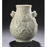 A CHINESE SOFT PASTE PORCELAIN DRAGON VASE, QING DYNASTY carved with two round panels of writhing