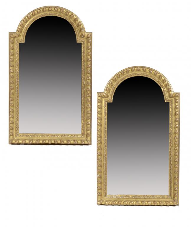 A PAIR OF IBERIAN GILTWOOD HEAVY GADROONED AND BREAKARCHED FRAMES, 20TH C enclosing mirrors, 127cm