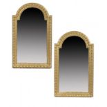 A PAIR OF IBERIAN GILTWOOD HEAVY GADROONED AND BREAKARCHED FRAMES, 20TH C enclosing mirrors, 127cm