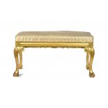 A GILTWOOD STOOL, EARLY 20TH C on acanthus carved legs, 48cm h; 46 x 92cm ++A good quality mid