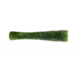 A CHINESE CARVED SPINACH JADE CIGARETTE HOLDER, 1920S/30S 7cm l ++In fine condition