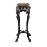 A CHINESE CARVED ROSEWOOD JARDINIÈRE STAND, C1900 with octagonal marble inset top, the pierced apron