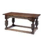 AN ELIZABETH I STYLE OAK TABLE, EARLY 20TH C the boarded top with cleated ends, on carved legs, 75cm