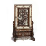 A CHINESE ROSEWOOD TABLE SCREEN, EARLY 20TH C inlaid with mother of pearl and with inset carved bone