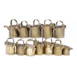 TWELVE VICTORIAN BRASS WATER CANS, LATE 19TH C various sizes, the largest 27cm h, several with