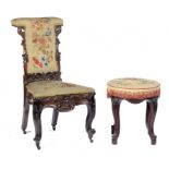 A VICTORIAN CARVED ROSEWOOD PRIE DIEU AND A VICTORIAN CARVED MAHOHGANY ROUND STOOL, MID AND LATE