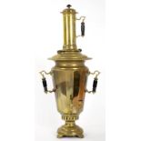 AN EASTERN EUROPEAN BRASS SAMOVAR AND COVER WITH TURNED, EBONISED WOOD HANDLES, 67CM H, EARLY 20TH