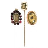 A VICTORIAN GOLD AND FOILED GARNET MOURNING BROOCH ADAPTED AS A PENDANT A VICTORIAN GOLD MOURNING