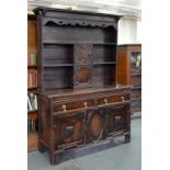 AN EARLY 20TH CENTURY OAK GEOMETRIC DRESSER AND RACK, 128CM W X 200CM H