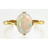 AN OPAL RING IN GOLD MARKED 18CT, 1.8G