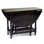 AN 18TH CENTURY AND LATER OAK GATELEG TABLE