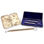 A PAIR OF SALTER NICKEL PLATED SPRING BALANCES, CASED, ANOTHER, LARGER IN LACQUERED BRASS AND A