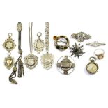 A QUANTITY OF SILVER WATCH FOB SHIELDS A VICTORIAN PASTE SET SILVER BROOCH AND OTHER SILVER