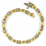 A DIAMOND AND TWO COLOUR GOLD BRACELET MARKED 14K, 13G