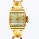 A TAVANNES GOLD LADY'S WRISTWATCH MARKED 14K ON GOLD BRACELET MARKED 9CT, 12.8G