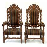 A PAIR OF 19TH CENTURY CARVED OAK ARMCHAIRS IN PAUL SMITH MAHARAM STRIPE FABRIC