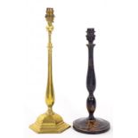 AN EARLY ELECTRIC BRASS TABLE LAMP OF BALUSTER FORM WITH COMPASS JOINT ON DOMED HEXAGONAL FOOT