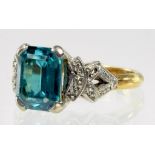 A BLUE ZIRCON AND DIAMOND RING IN GOLD MARKED 18CT, 4.5G