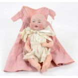 A GERMAN BISQUE HEADED COMPOSITION BABY DOLL 26CM H EARLY 20TH CENTURY