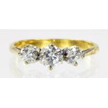 A DIAMOND THREE STONE RING IN GOLD MARKED 18CT, 2.2G