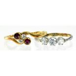 A RUBY AND DIAMOND CROSSOVER RING IN GOLD MARKED 18CT AND ANOTHER GOLD RING, 3.6G