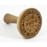 A LATE VICTORIAN OR EARLY 20TH CENTURY CARVED WOOD BUTTER STAMP WITH A ROSE AND INSCRIBED WILMOTT