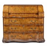 A GERMAN SERPENTINE FIGURED WALNUT BUREAU, C1750 with fitted interior, 108cm h; 91 x 124cm ++Minor