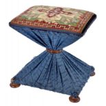 A VICTORIAN FABRIC COVERED STOOL, C1850 with woolwork seat and rosewood feet, 42cm h, 43cm w ++