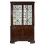 A GEORGE III MAHOGANY CORNER CUPBOARD, C1780 fitted with a central drawer, 207cm h; 55 x 125cm ++The