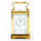 A FRENCH BRASS CARRIAGE CLOCK THE GONG STRIKING MOVEMENT WITH ALARM, DAY AND DATE, BY RAPPORT IN